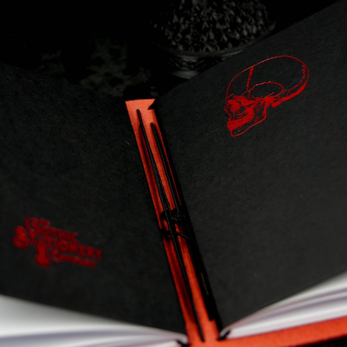 Close up of our gothic travellers notebook in our red leather gothic journal
